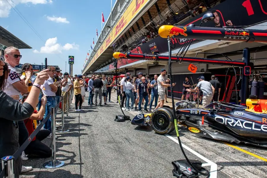 Formula 1 Grand Prix pit lane with fans